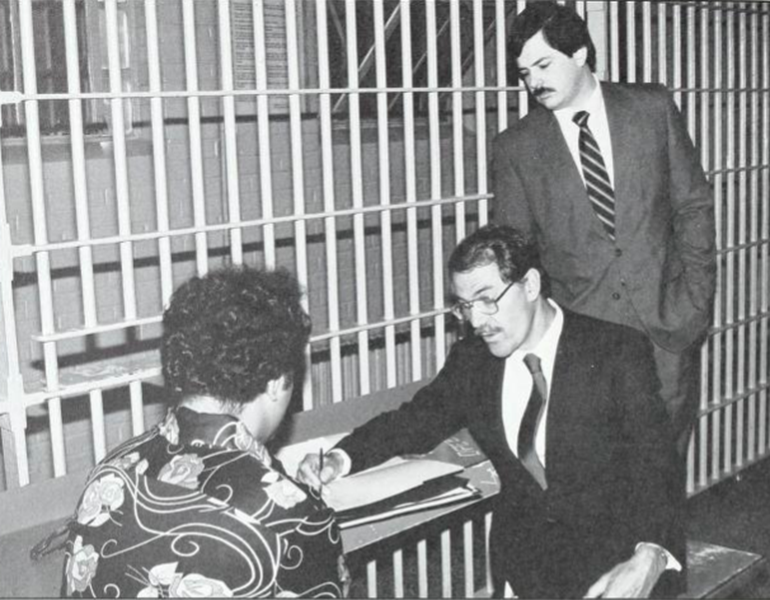 Steven Ward (JD ’83) watches his supervising attorney advise a client as part of the Criminal clinic.